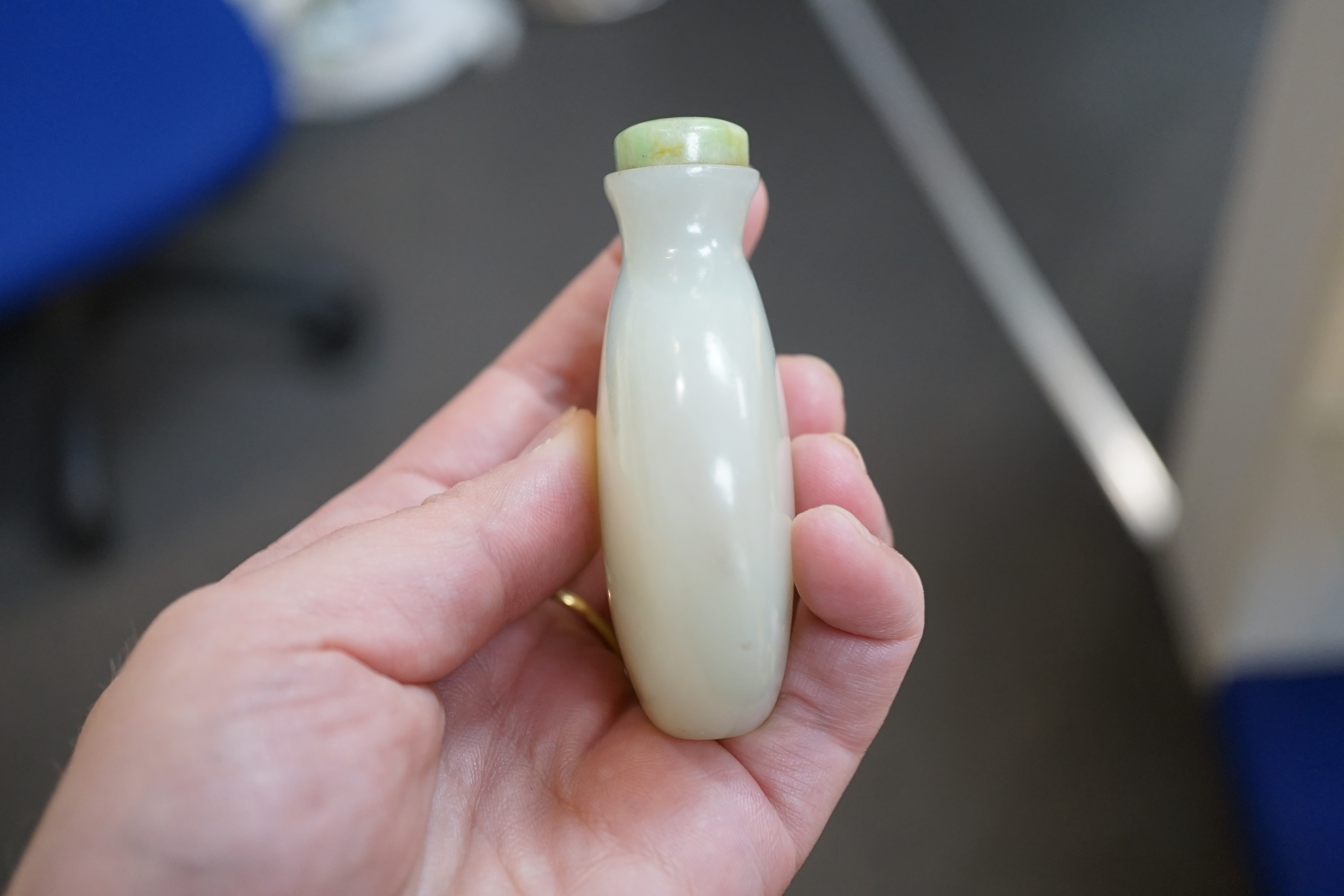 A Chinese pale celadon jade snuff bottle, of moonflask form, 19th century